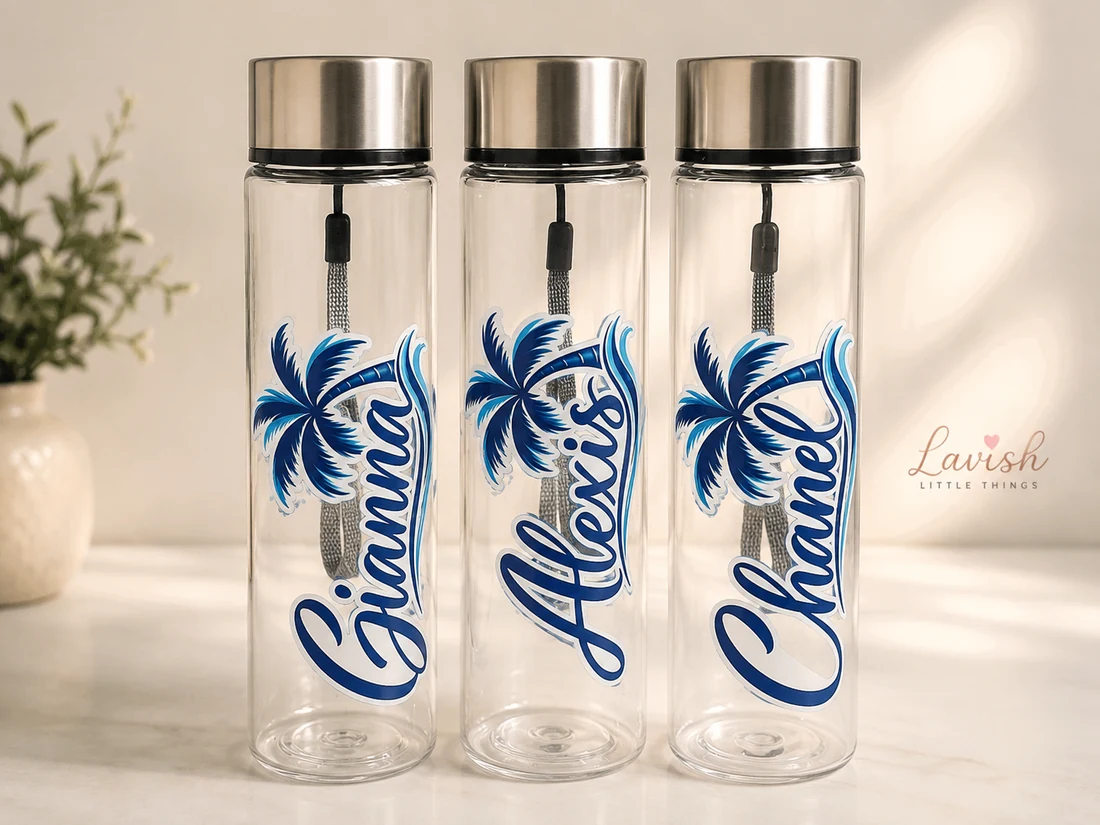 Three clear water bottles personalized with blue names and palm trees